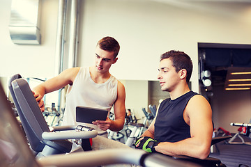 Image showing men exercising on gym machine