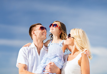 Image showing happy family with blue sky