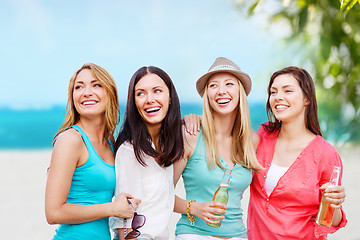 Image showing girls with drinks on the beach