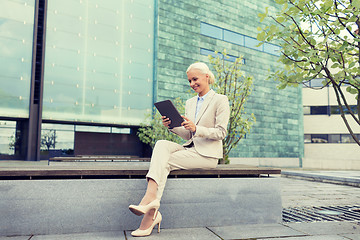 Image showing smiling businesswoman with tablet pc outdoors