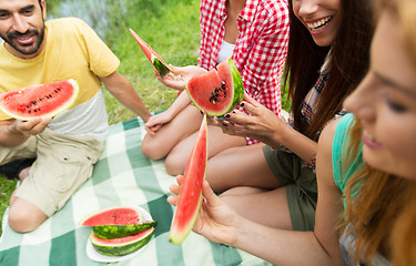 Image showing happy friends eating watermelon at camping