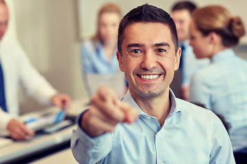 Image showing group of smiling businesspeople meeting in office