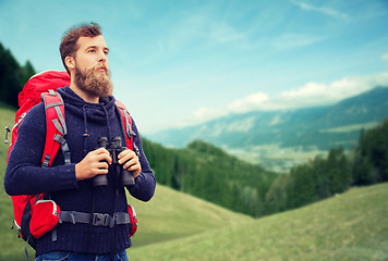 Image showing man with backpack and binocular outdoors