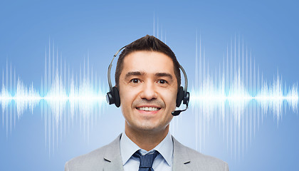 Image showing businessman in headset over sound wave or diagram