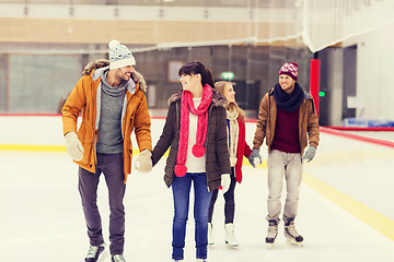 Image showing happy friends on skating rink