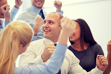 Image showing smiling business people meeting in office