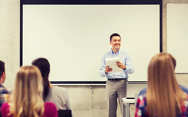 Image showing group of students and teacher with notepad