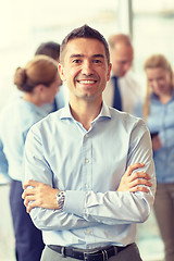 Image showing group of smiling businesspeople meeting in office