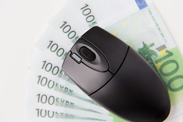 Image showing close up of computer mouse and euro money