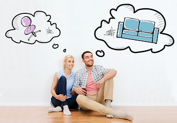 Image showing happy couple of man and woman moving to new home