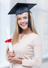 Image showing student in graduation cap with certificate