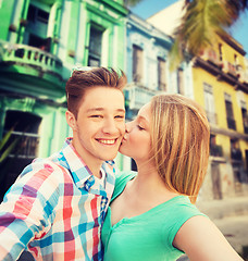 Image showing couple kissing and taking selfie over city street