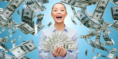 Image showing happy laughing businesswoman with dollar money