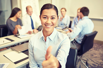 Image showing group of smiling businesspeople meeting in office