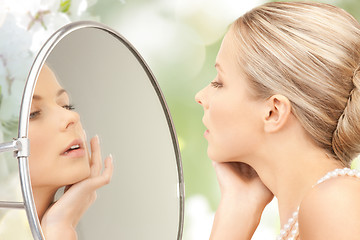 Image showing beautiful woman with pearl necklace and mirror