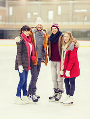 Image showing happy friends on skating rink