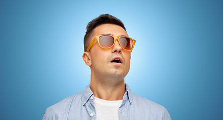 Image showing face of scared man in shirt and sunglasses