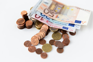 Image showing close up of euro paper money and coins on table