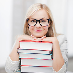 Image showing student with stack of books