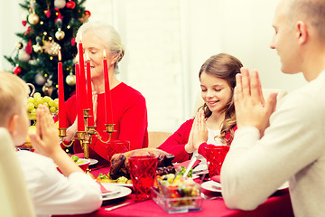 Image showing smiling family having holiday dinner at home