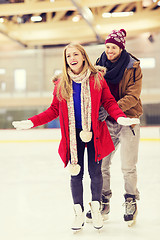 Image showing happy couple on skating rink