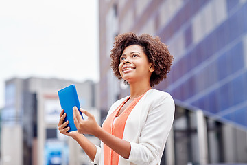 Image showing happy african businesswoman with tablet pc in city