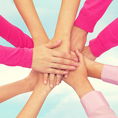 Image showing close up of women with hands on top