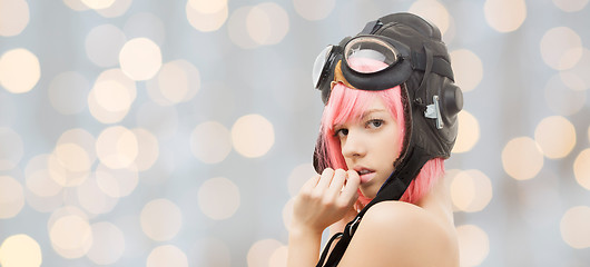 Image showing girl in aviator helmet over holidays lights