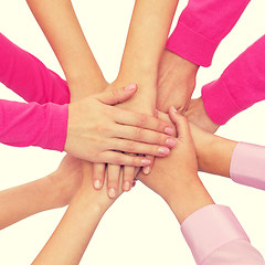 Image showing close up of women with hands on top