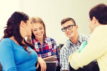 Image showing group of smiling students in lecture hall