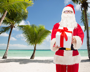 Image showing man in costume of santa claus with gift box