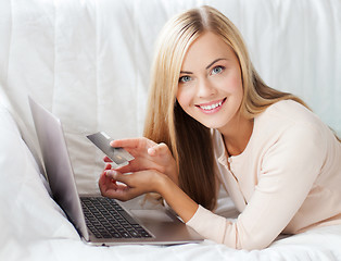 Image showing businesswoman with laptop and credit card