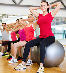 Image showing group of people working out in pilates class