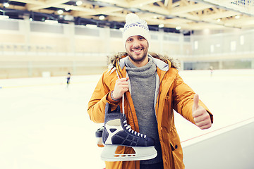 Image showing happy young man showing thumbs up on skating rink