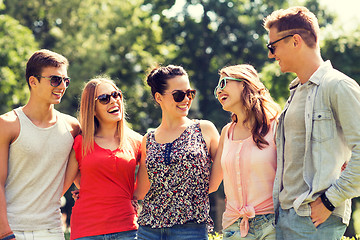 Image showing group of smiling friends outdoors