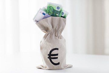 Image showing close up of euro paper money in bag on table