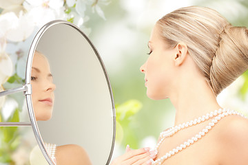 Image showing beautiful woman with pearl necklace and mirror