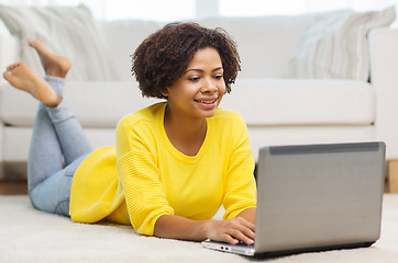 Image showing happy african american woman with laptop at home