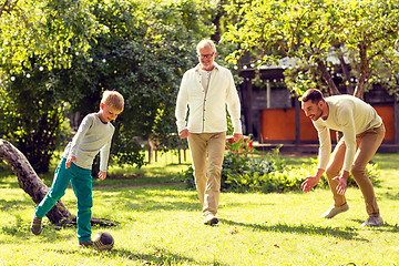 Image showing happy family playing football outdoors