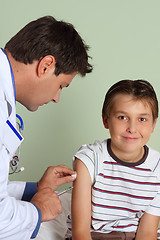 Image showing Doctor injecting child vaccine