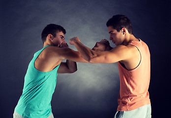 Image showing young men wrestling