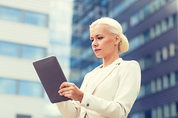 Image showing businesswoman working with tablet pc outdoors