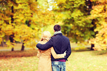 Image showing couple hugging in autumn park from back