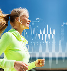 Image showing smiling woman doing running outdoors