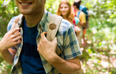 Image showing close up of friends with backpacks hiking