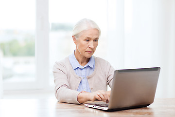 Image showing senior woman with laptop at home