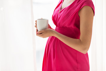Image showing pregnant woman with cup drinking tea at home
