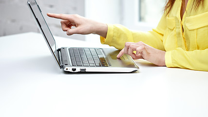 Image showing close up of woman with laptop computer in office