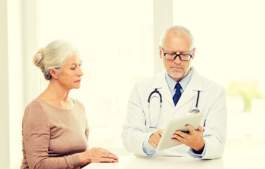 Image showing senior woman and doctor with tablet pc