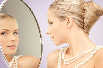 Image showing beautiful woman with pearl necklace and mirror